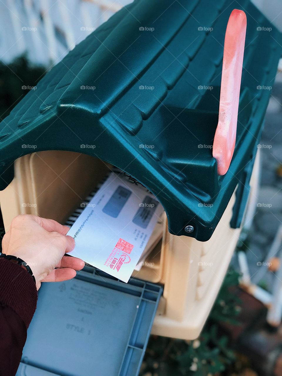 Hand getting mail out of mailbox, woman receiving mail at her home, looking in the mailbox, house mailbox, daily routines at your home, mailbox view, first person view 