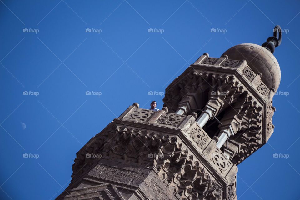 Islamic architecture. A man looking from the minaret.