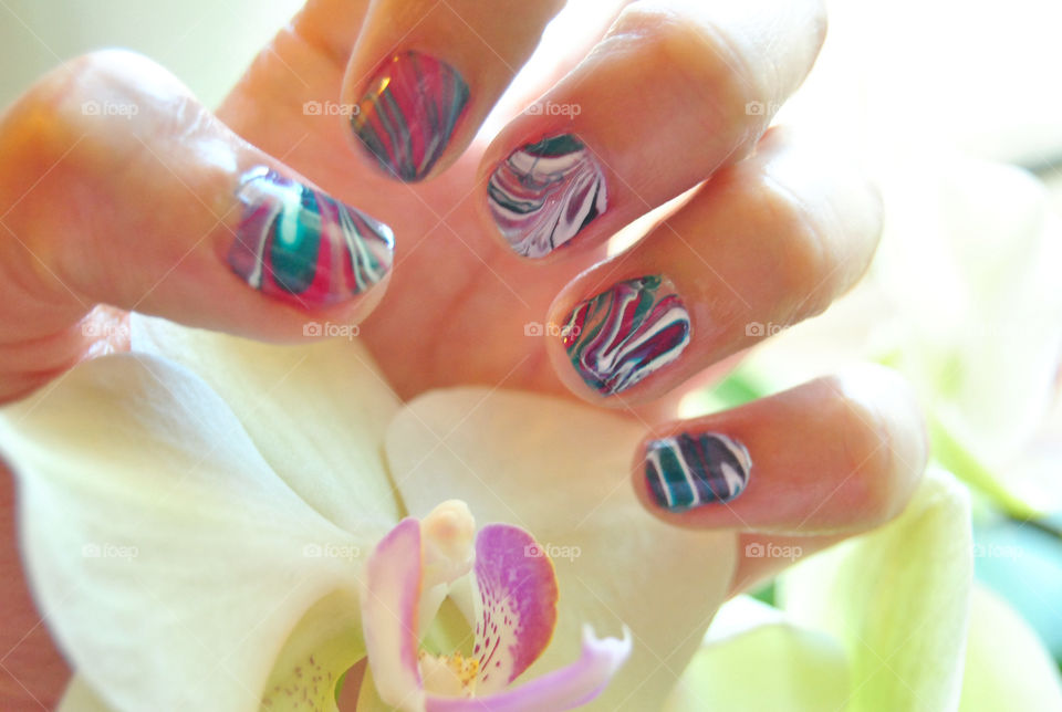 water marble nail art in purple, magenta, bluegreen and white. pretty orchid. nail polish