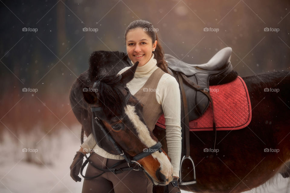 Young beautiful woman with horse outdoor portrait at spring day