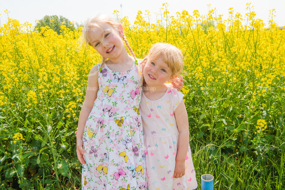 Two young sisters are playing in the Raps field outside the city Malmö in Sweden.