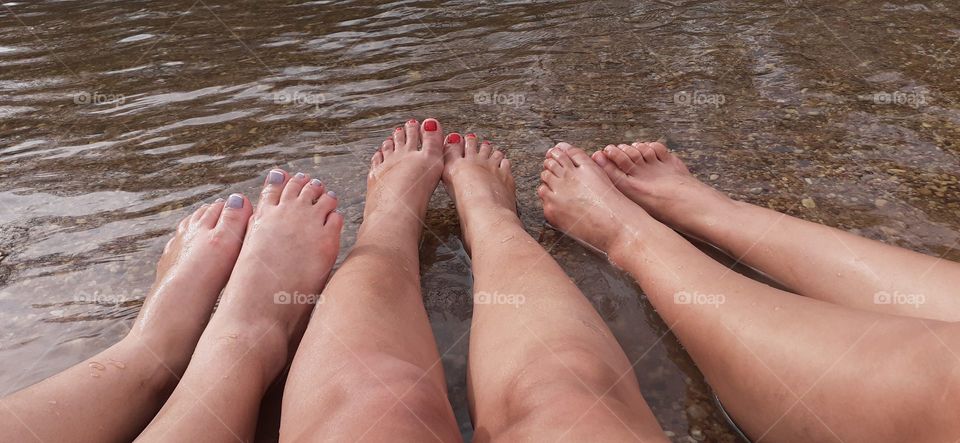feet refreshing in the waters of the river