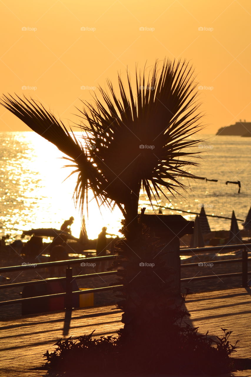 sun setting over beach in Alanya turkey.