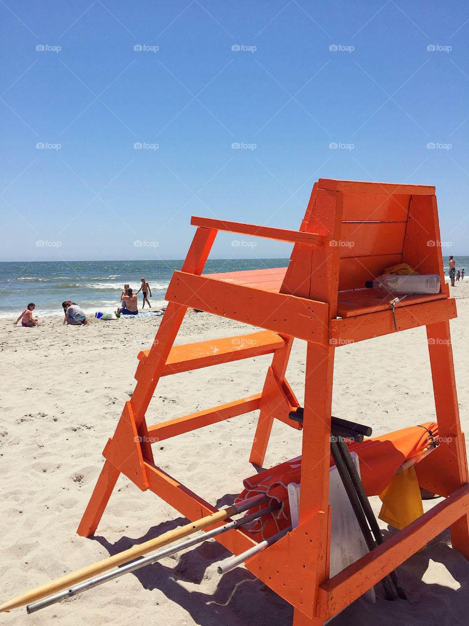 Orange lifeguard chair at the beach. 