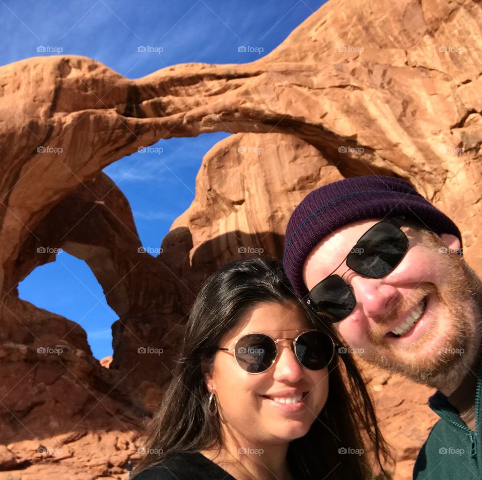 Happy couple travelling. Arches National park usa.