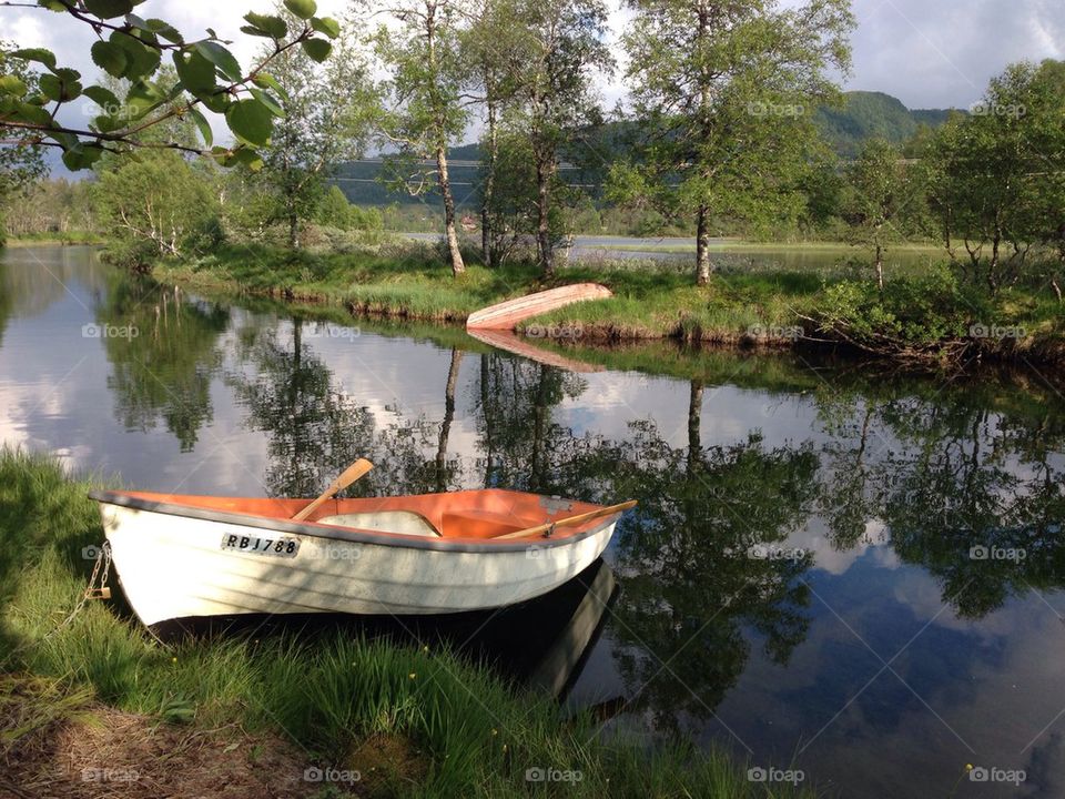 Row boat by the river