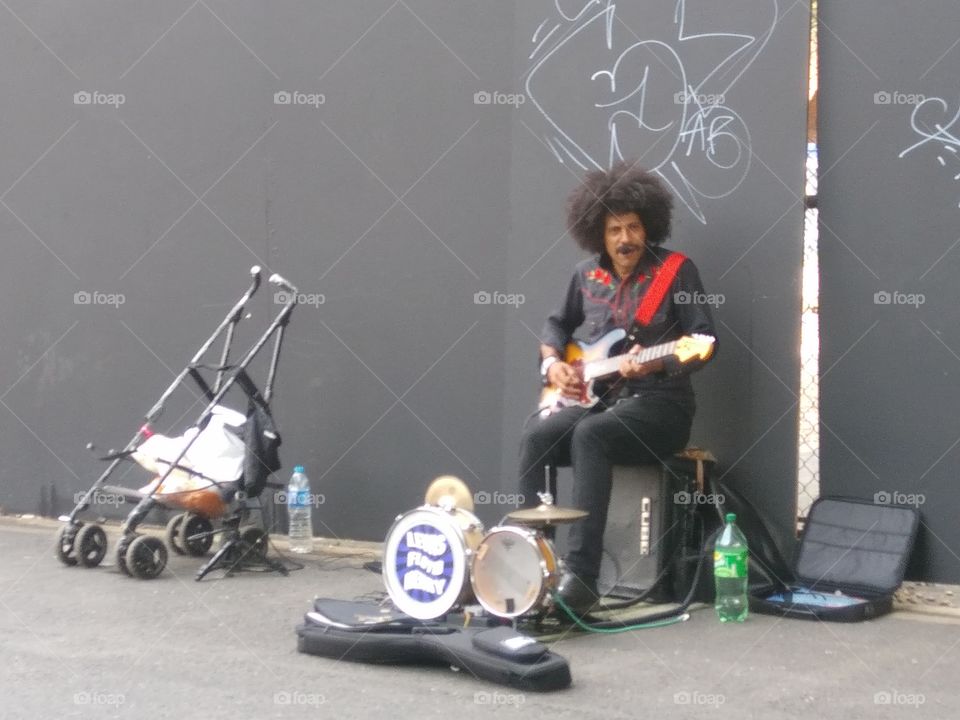 I saw this amazing busker on my way to Brick Lane Market in London. He sang and played his music with passion.