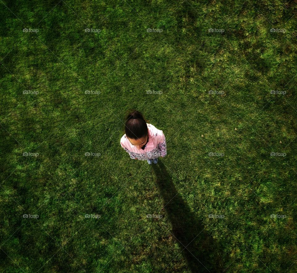 Sport girl on a grass pitch