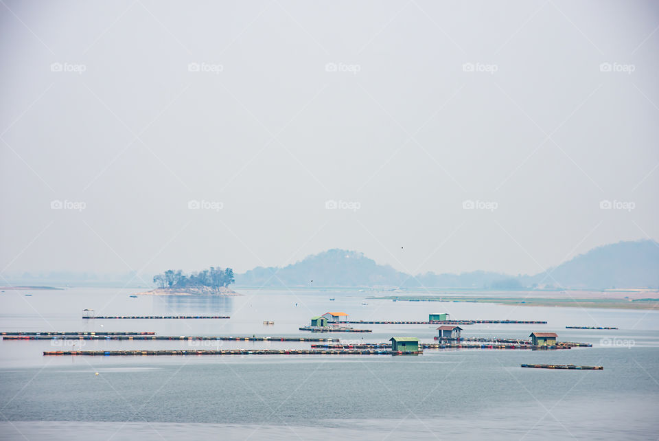 The raft floating fish farming and birds in Krasiew dam ,Supanburi Thailand.