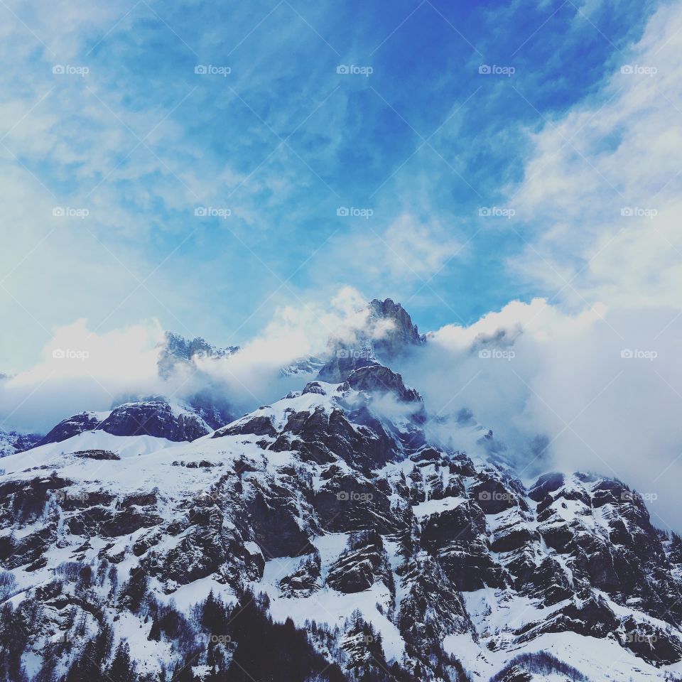 mountain peaks in the clouds