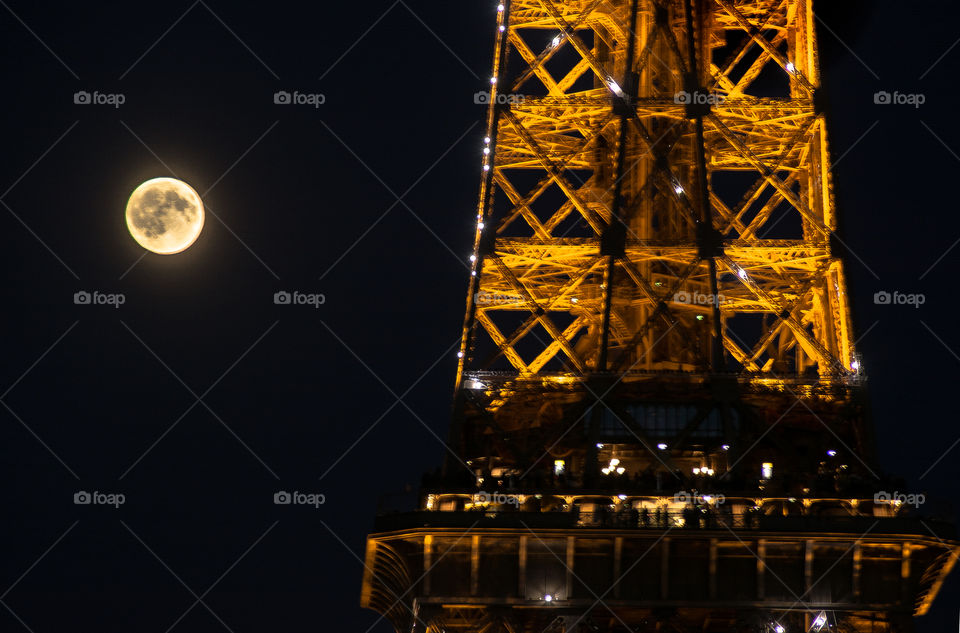 Full moon and the eiffel tour