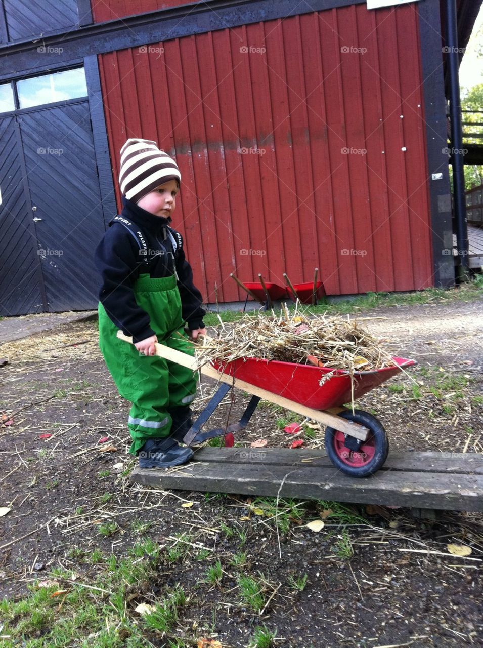 Boy with small wheelbarrow 