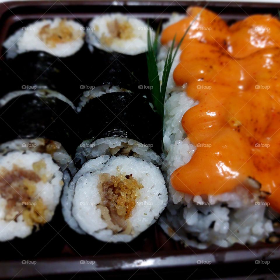 assorted sushi served in a container