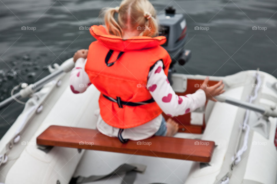 Girl on rubber dinghy