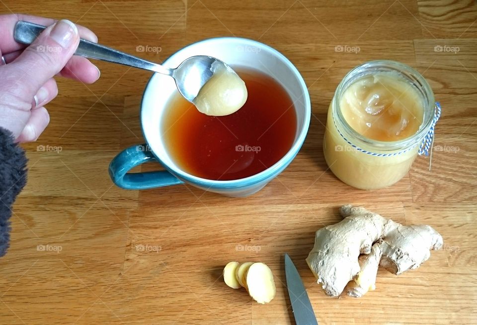 a spoon of honey in the tea