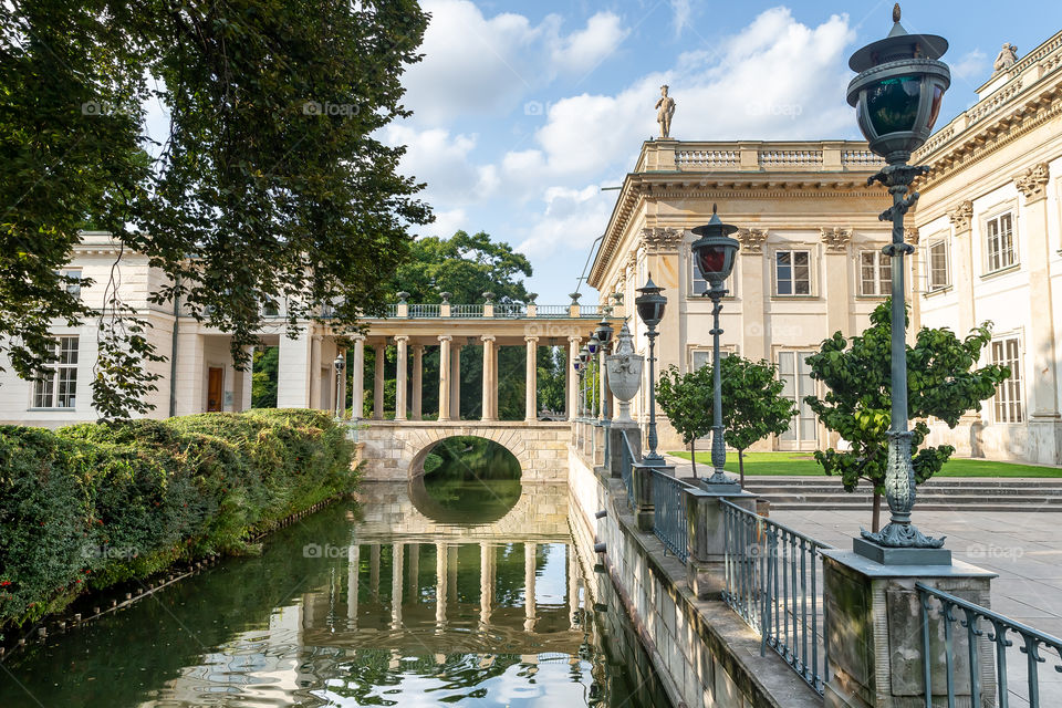 Bridge at the castle in Warsaw reflecting in a pond