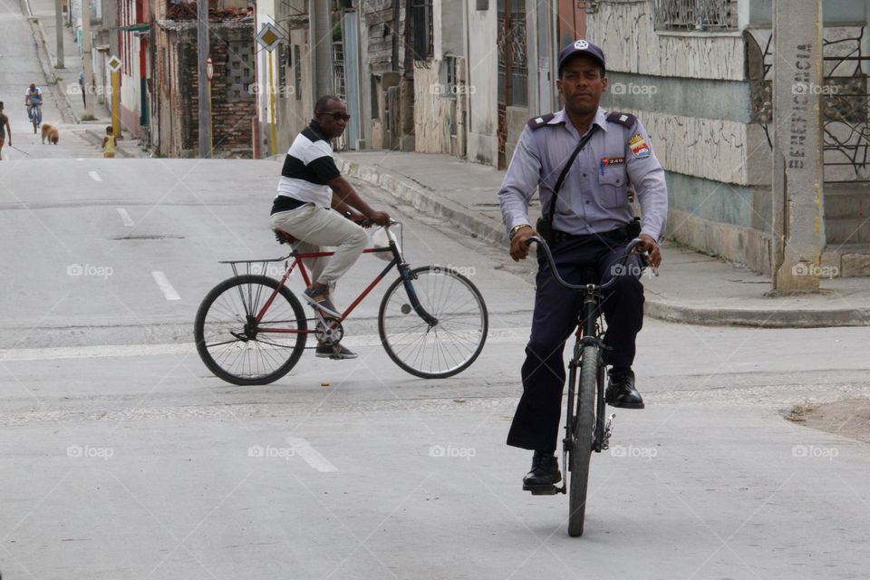 Cuban People.Police officer on bike.