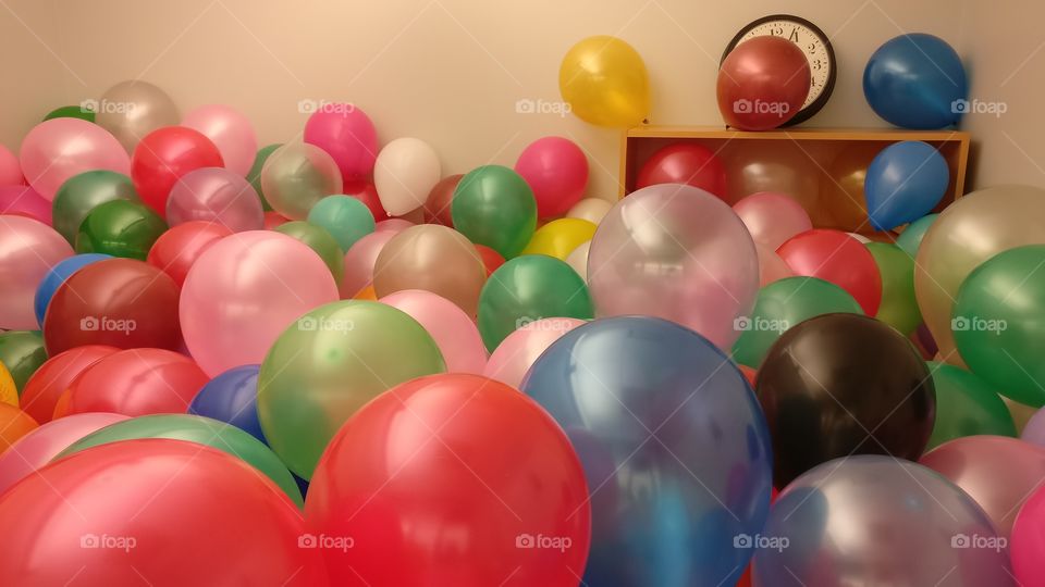 Colorful balloons in my boss room, surprise for my boss, room full of colorful balloons