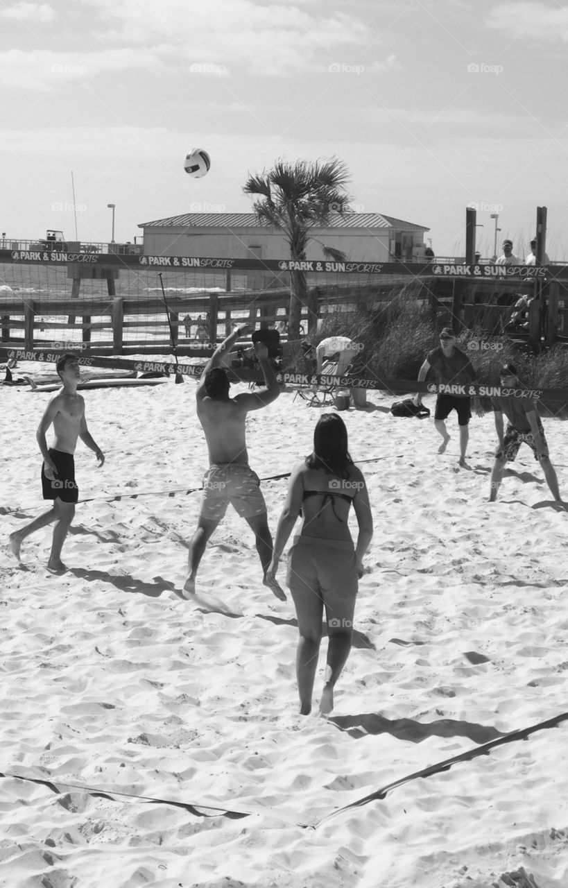 Spring breakers invade the Northwest Florida Beaches - in a good way! Spring breakers enjoy the sunny weather as they have fun playing in the sugary white sands in front of the Gulf of Mexico! Spring is here!