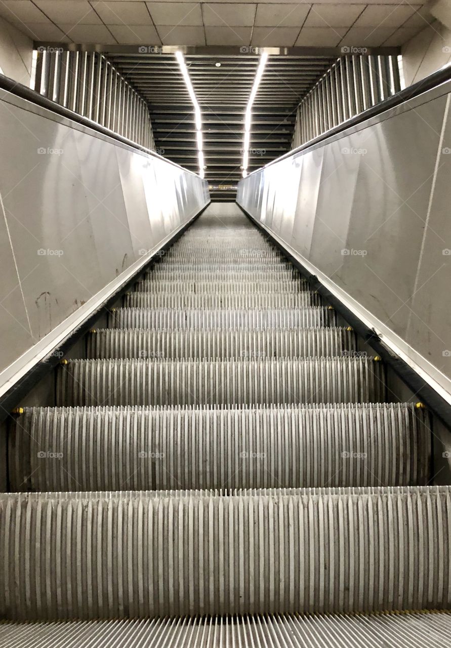 Mysterious subway escalator at night that plays tricks with your eye. You can’t tell up from down. The beauty is, it could be taking you anywhere. Imagination to follow. 