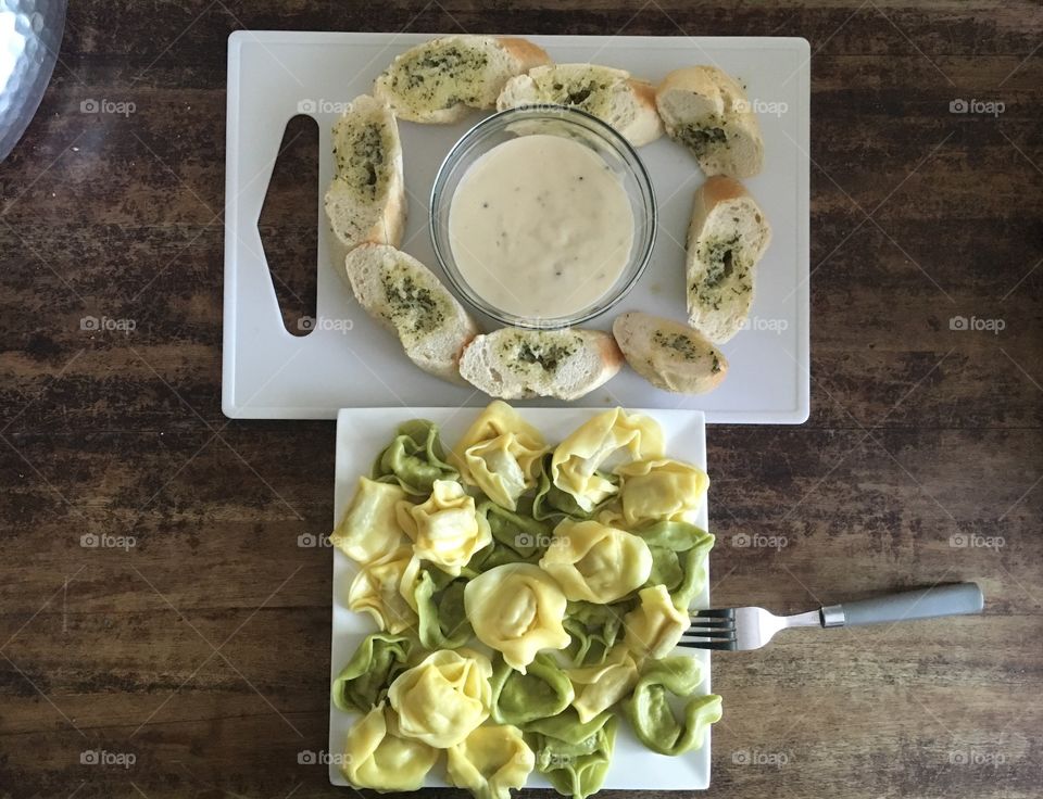 Tortellini with carbonara dip and french with garlic 