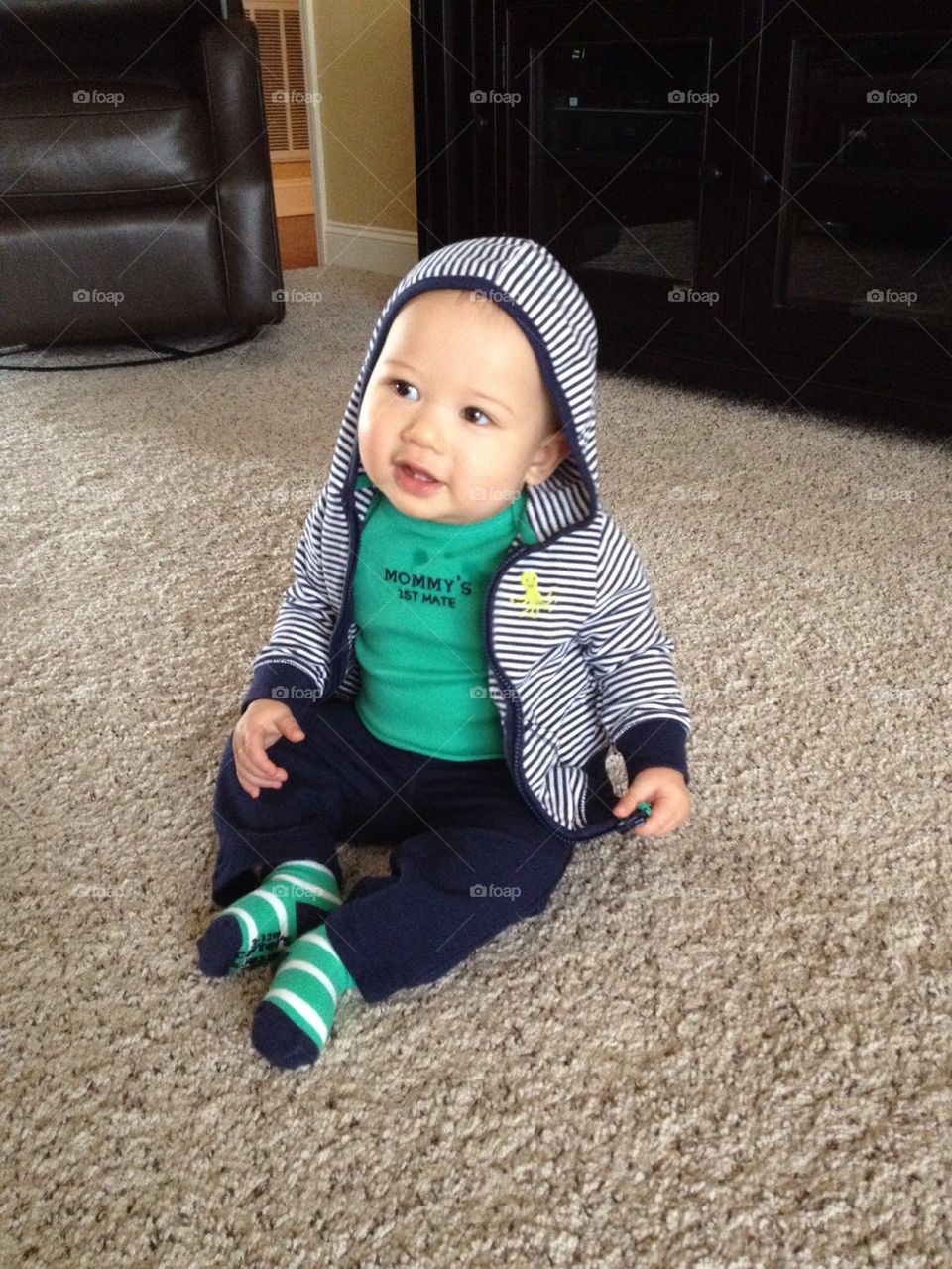 Baby sitting on carpet