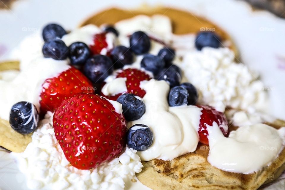 Blueberry and strawberries. Blueberry, strawberry and whipped cream