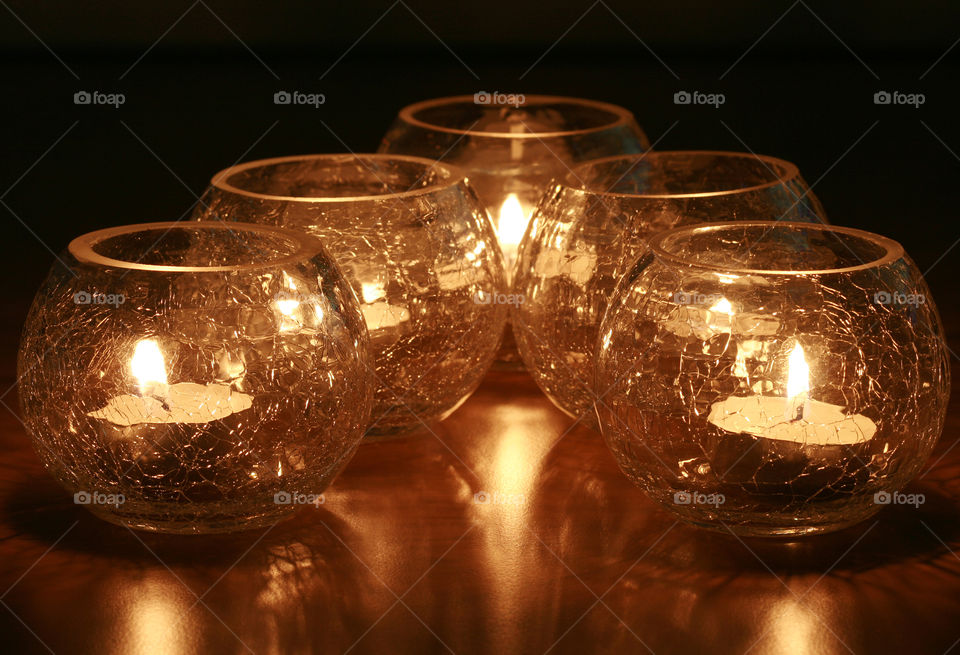 5 shattered glass candle holders glowing in the dark
