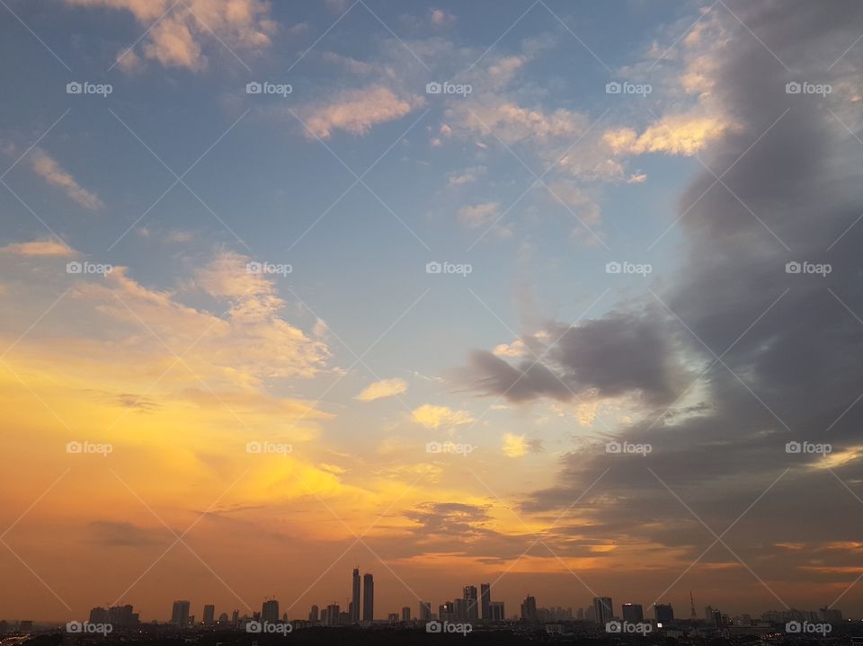Beautiful orange sunset view of  cityscape and its silhouette in Johor Bahru, Malaysia