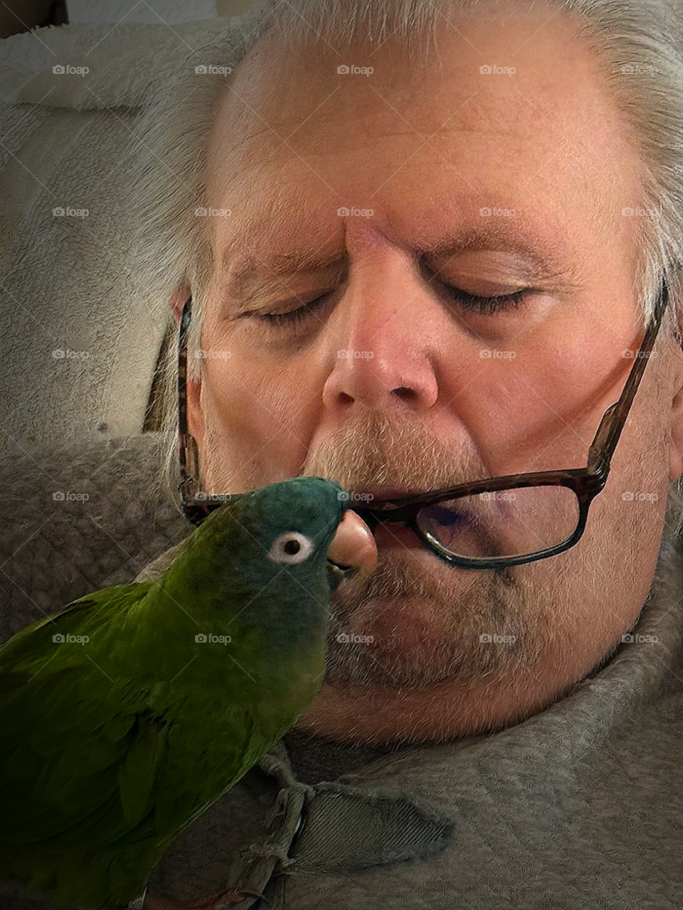 Wake up man!  Man and small parrot.