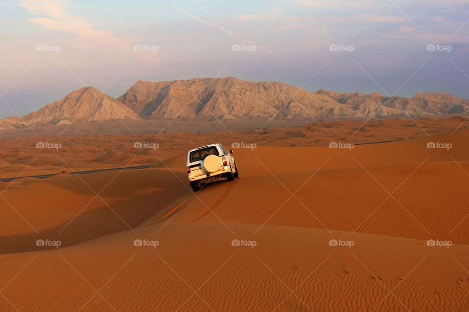 4x4 vehicle in desert sand, dubai, united Arab Emirates