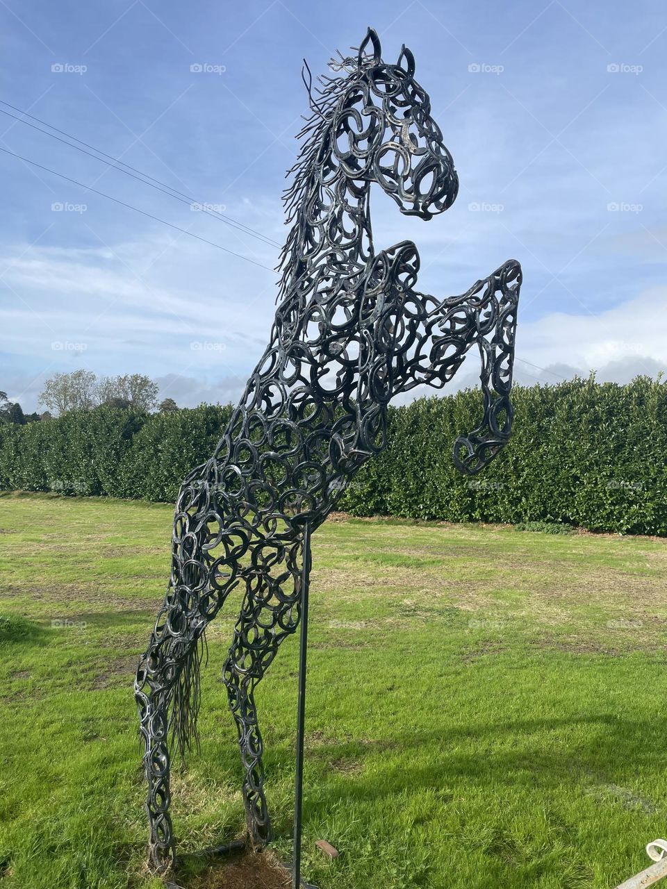 Beautiful creative horse sculpture made entirely from horse shoes !