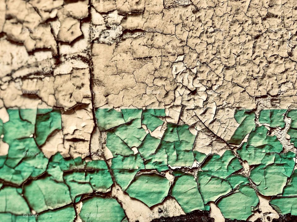 Peeling paint in prison, a colorful wall paint peeling in a prison, colorful paint peeling off the wall