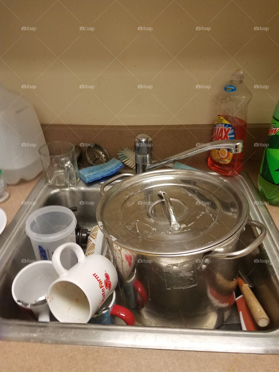 Sink full of dirty dishes