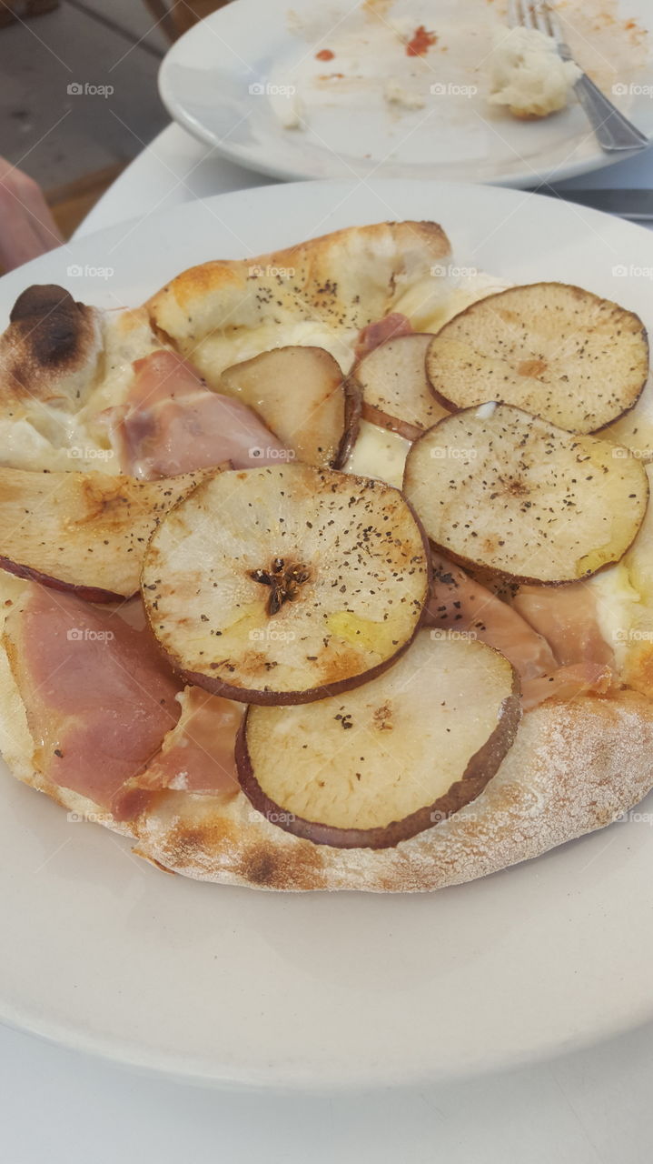 Delicious prosciutto and pear pizza from our local Italian inspired pizza joint.
