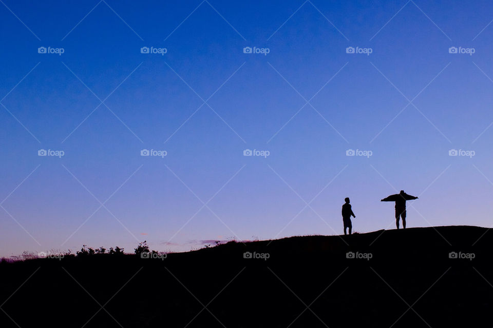 Two men upon a high hill