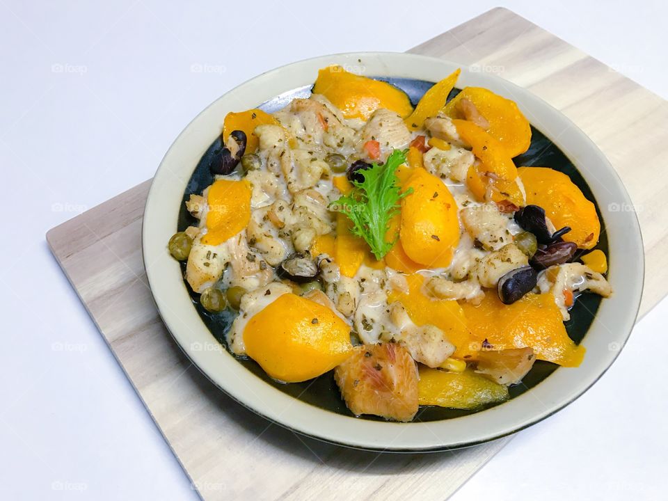 Steamed chicken breast with ripe sweet Thai Marian plum or plango (plum mango)