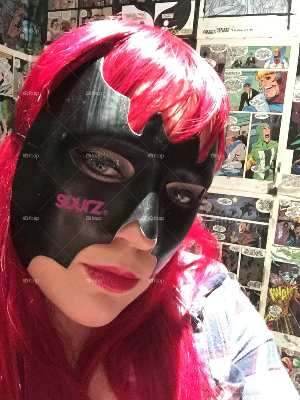 Woman wearing batman mask