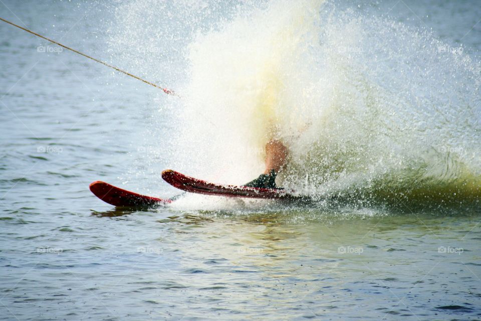Water-skiing, big splash.
