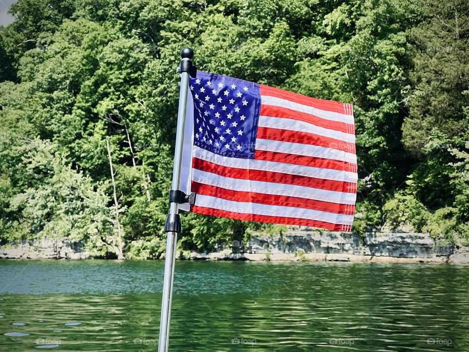 The USA flapping in the breeze on a hot Fourth of July holiday 