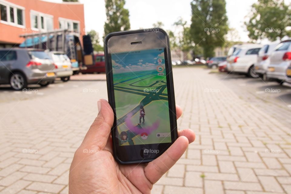 Playing Pokémon-go while walking on the parking lot