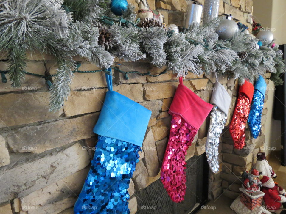 Christmas stockings hanging on the fireplace.