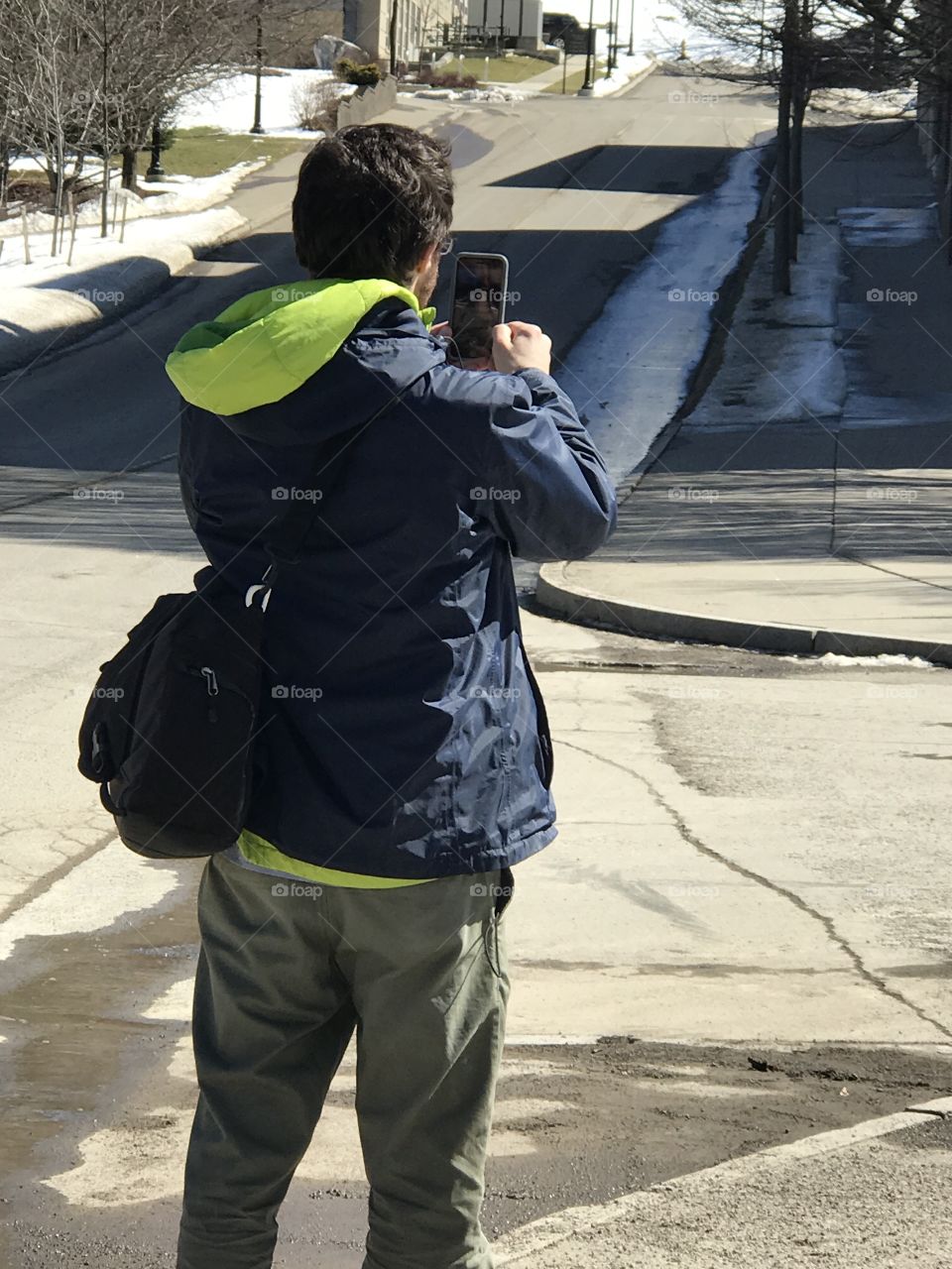 Architect taking panoramic photos of surrounding area
