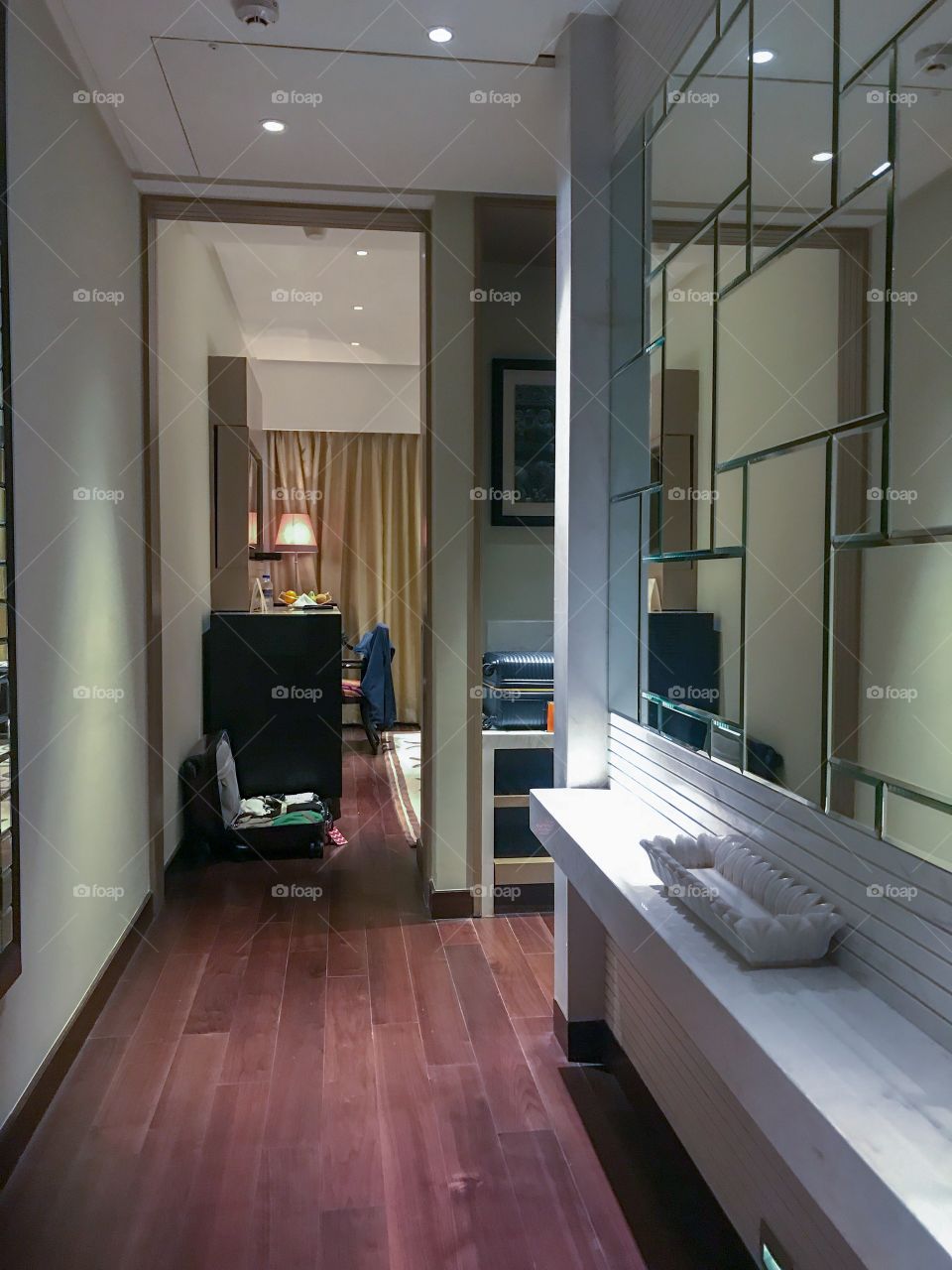 Hotel rooms with glass, mirrors & various lights ...