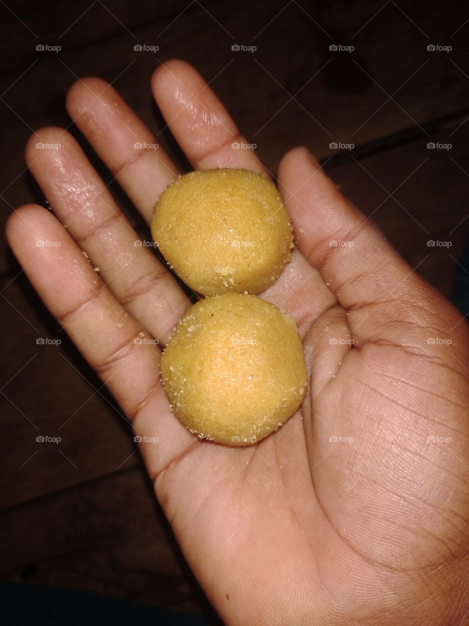 two sweets in a hand evening time