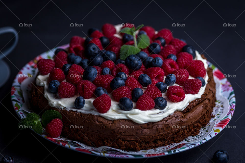 Berries on fruits cake