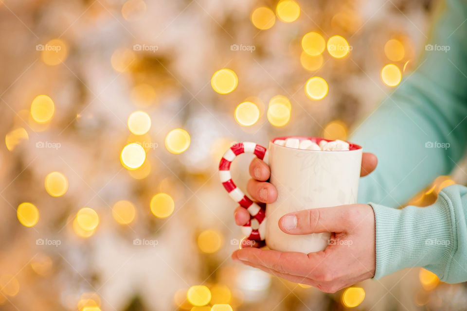 cup of coffee in a cozy festive Christmas atmosphere