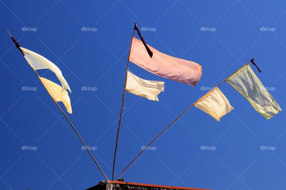 blue sky with flags