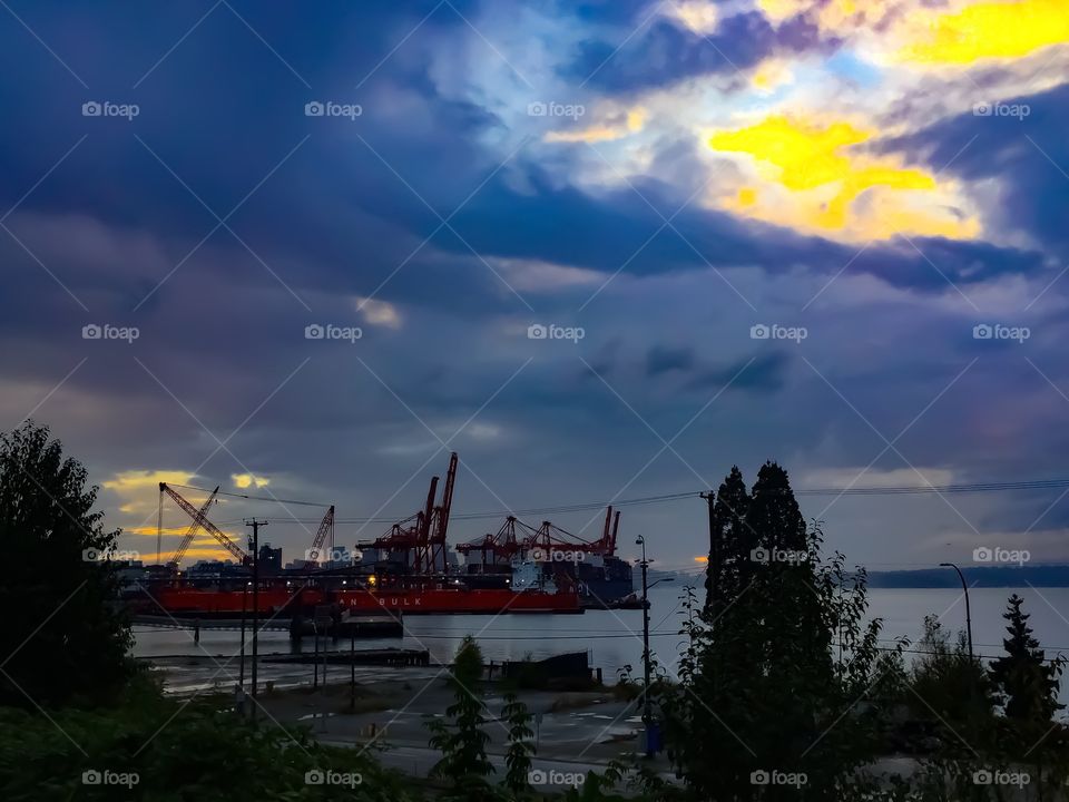View of downtown Vancouver behind the local shipyards on a rainy day in British Columbia 