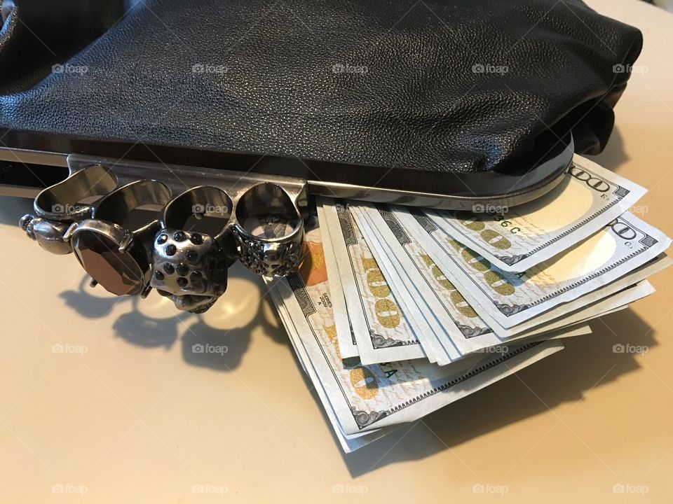 Going shopping with U.S. paper money in purse.